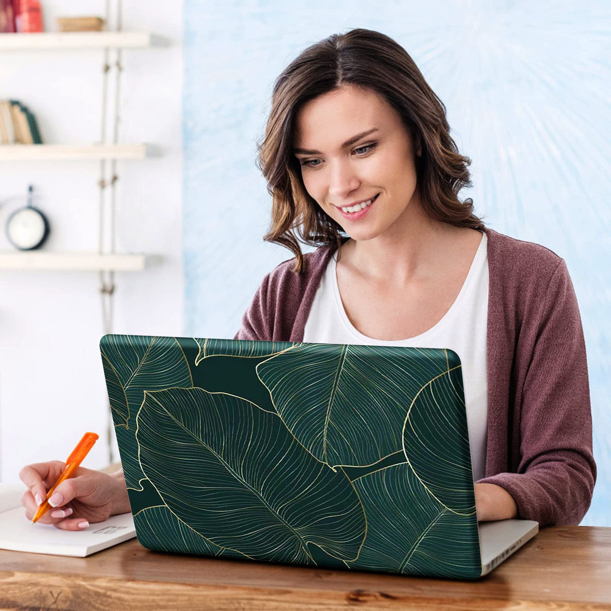 DINKY green leaf laptop skin with removable layer demonstrates residue-free peel.