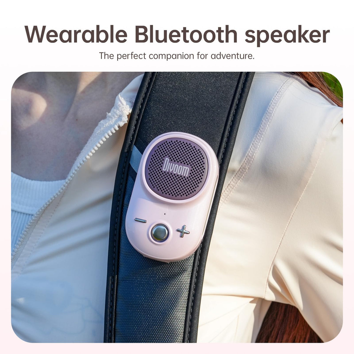 Divoom Itour-S clipped to backpack strap during hike, durable outdoor listening