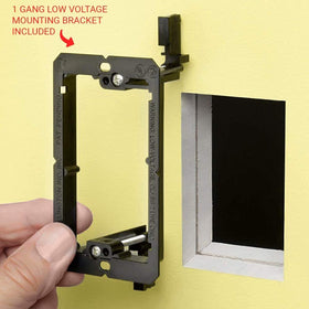 DIYTECH wall jack installed in living room next to speaker, demonstrating tidy audio connection convenience