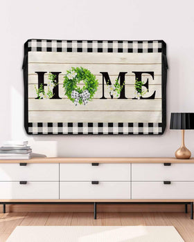 DOME-SPACE front view of retro plaid cover protecting TV, adds vintage charm