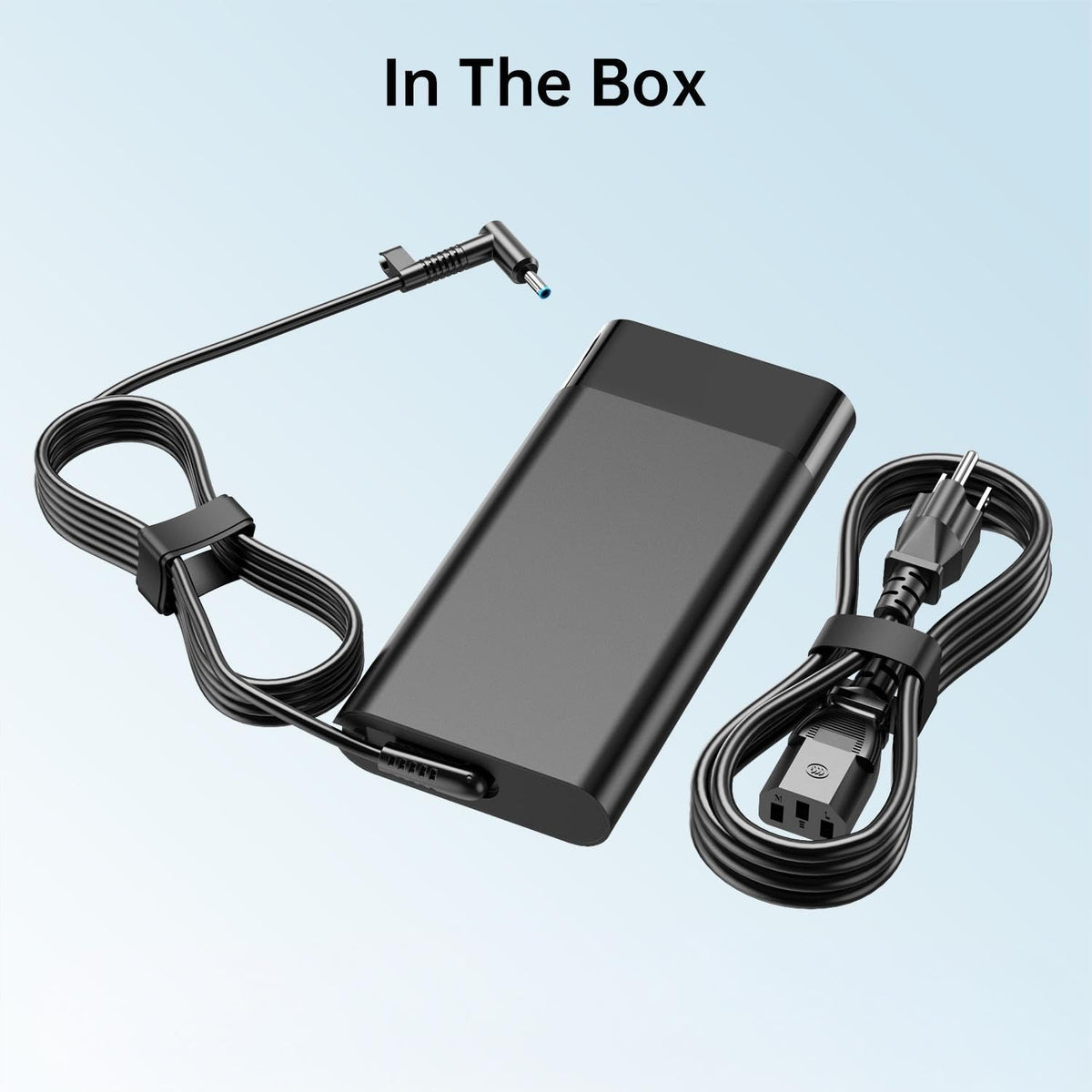 DONGERDI charger beside a laptop illustrating compact size and portability