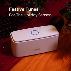 DOSS SoundBox Touch on a desk next to laptop, DOSS enhances workday audio