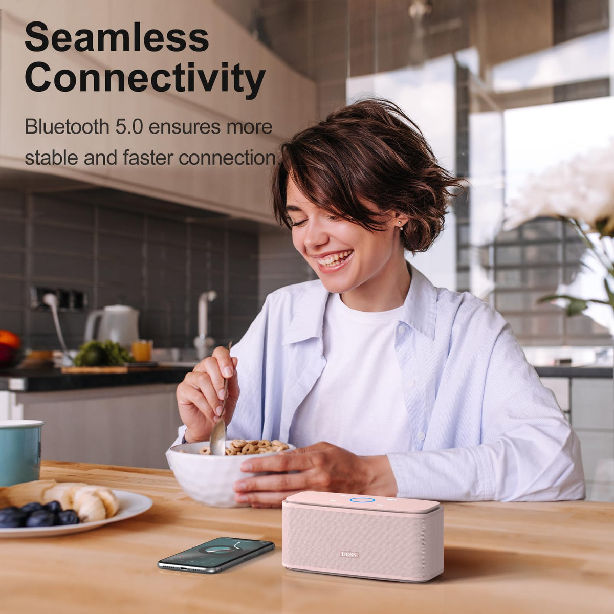 DOSS SoundBox Touch held in hand to show compact scale and easy portability advantage