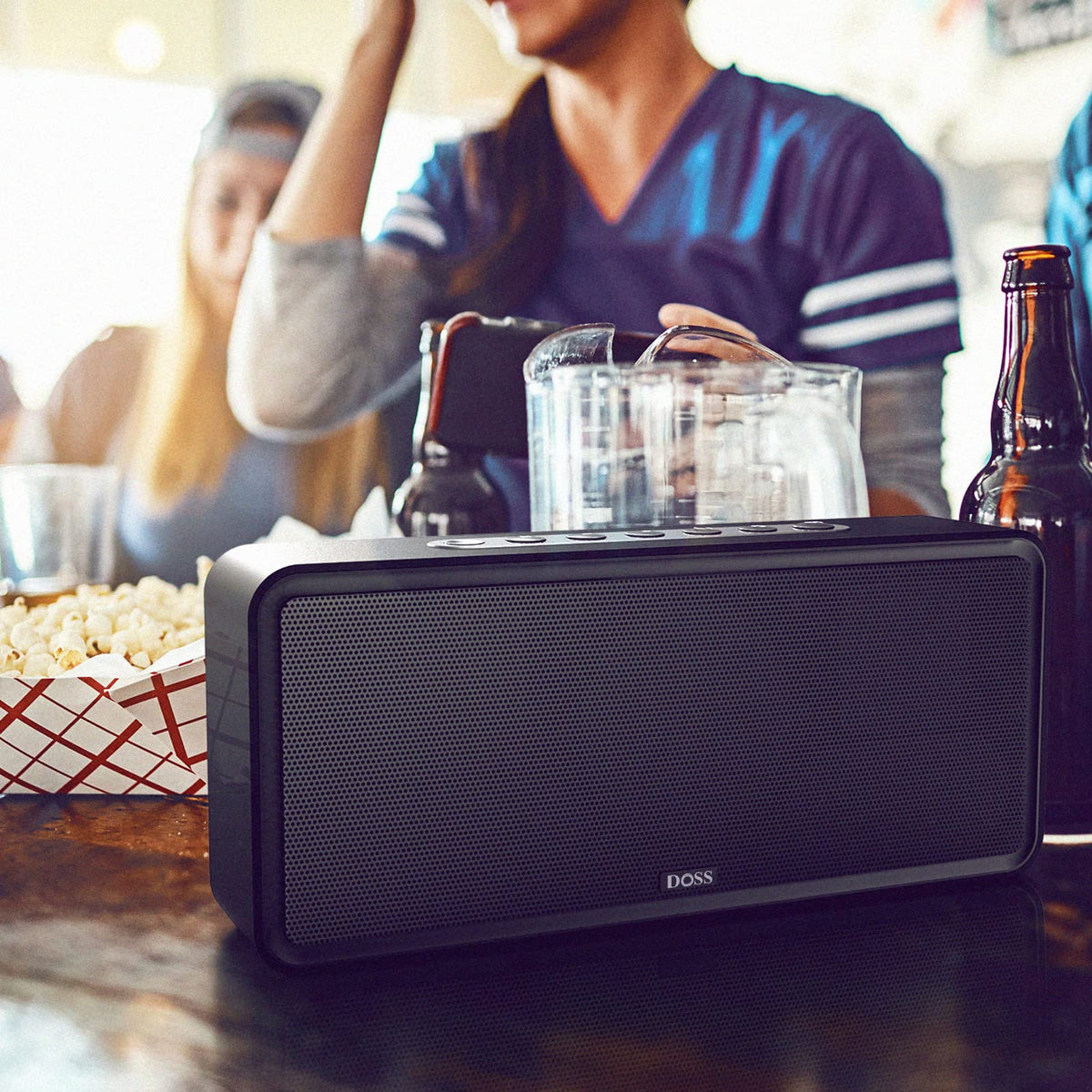 DOSS SoundBox XL in a living-room lifestyle scene for party-ready audio benefit