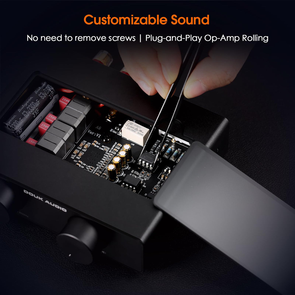 Douk Audio A5 next to bookshelf speaker demonstrating compact size and power