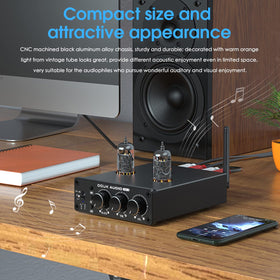 Douk Audio P6 MINI held in hand for scale, compact footprint saves space