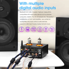 Douk Audio top view emphasizing compact chassis and decorative golden rings