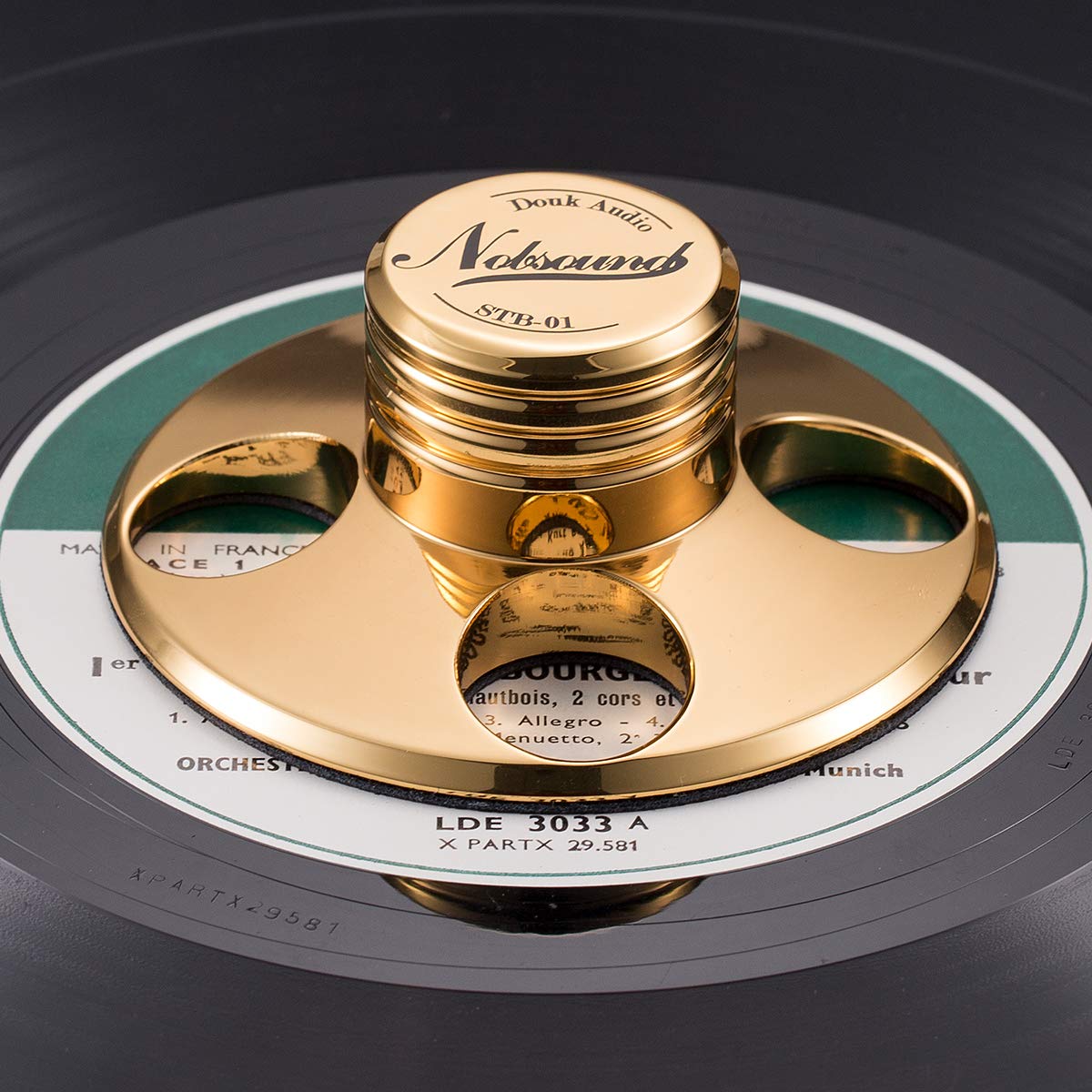 Douk Audio STB-01 gold stabilizer top view highlights compact zinc alloy design