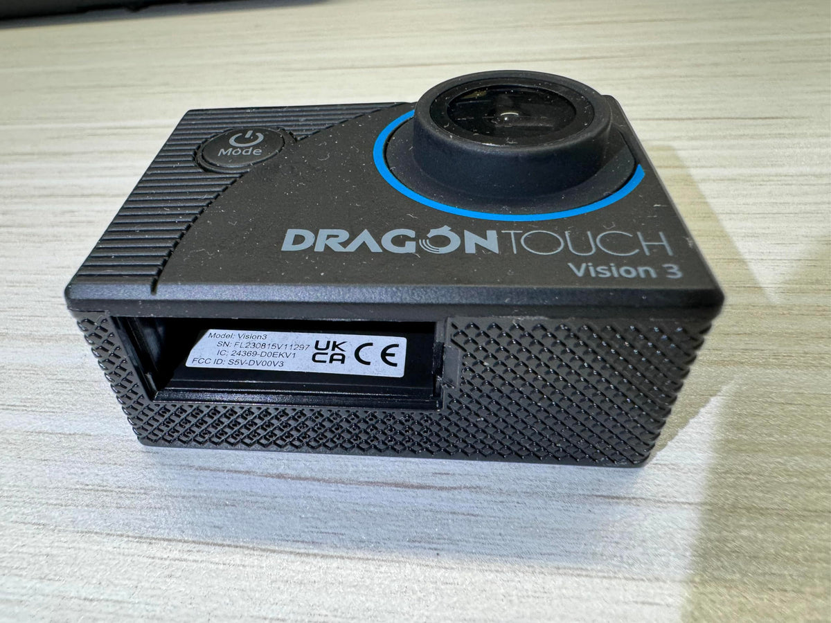 Dragon Touch Vision 3 lifestyle beach shot capturing underwater and surf-friendly use