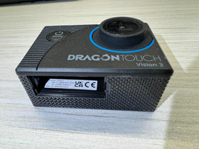 Dragon Touch Vision 3 lifestyle beach shot capturing underwater and surf-friendly use