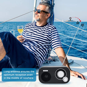 DreamSky portable radio plugged in with AC adapter for home use.