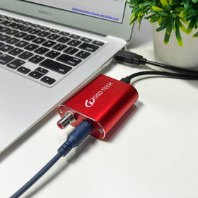 DSD TECH SH-AU02A compact design beside a laptop for travel use.