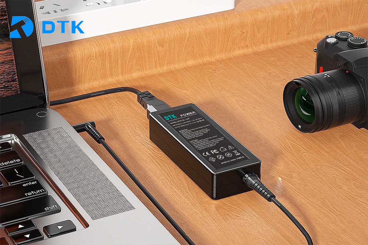 DTK 90W ASUS charger side view showing compact travel design.
