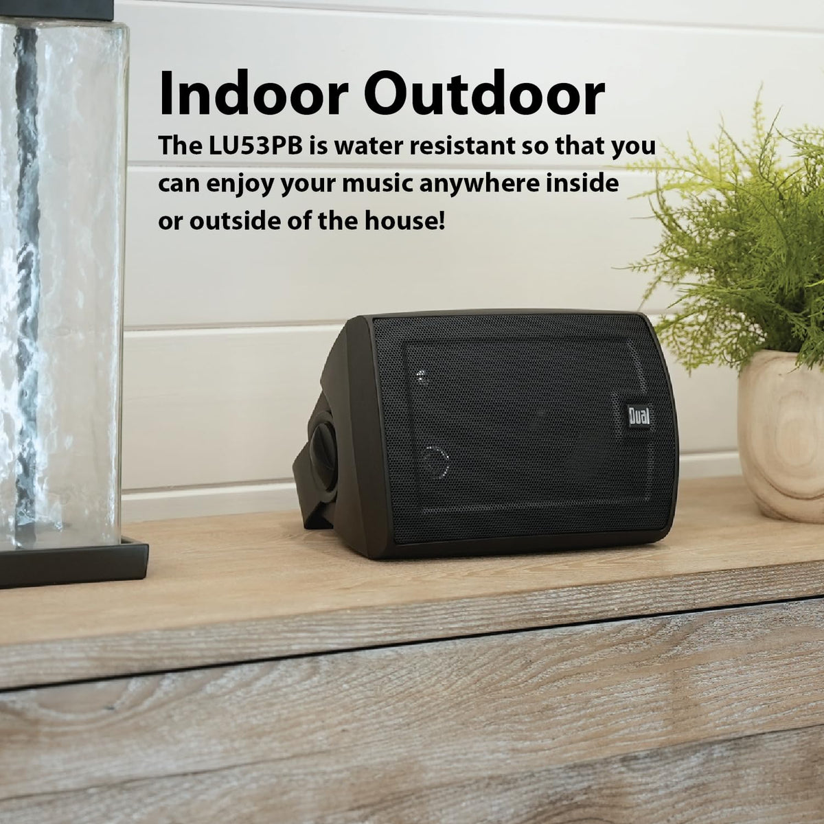 LU53PB placed on a bookshelf adding balanced 3-way sound to a living room