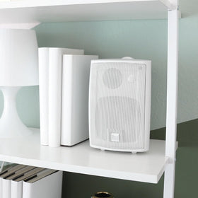 Baffle design detail highlights clean aesthetics for bookshelf or outdoor walls.
