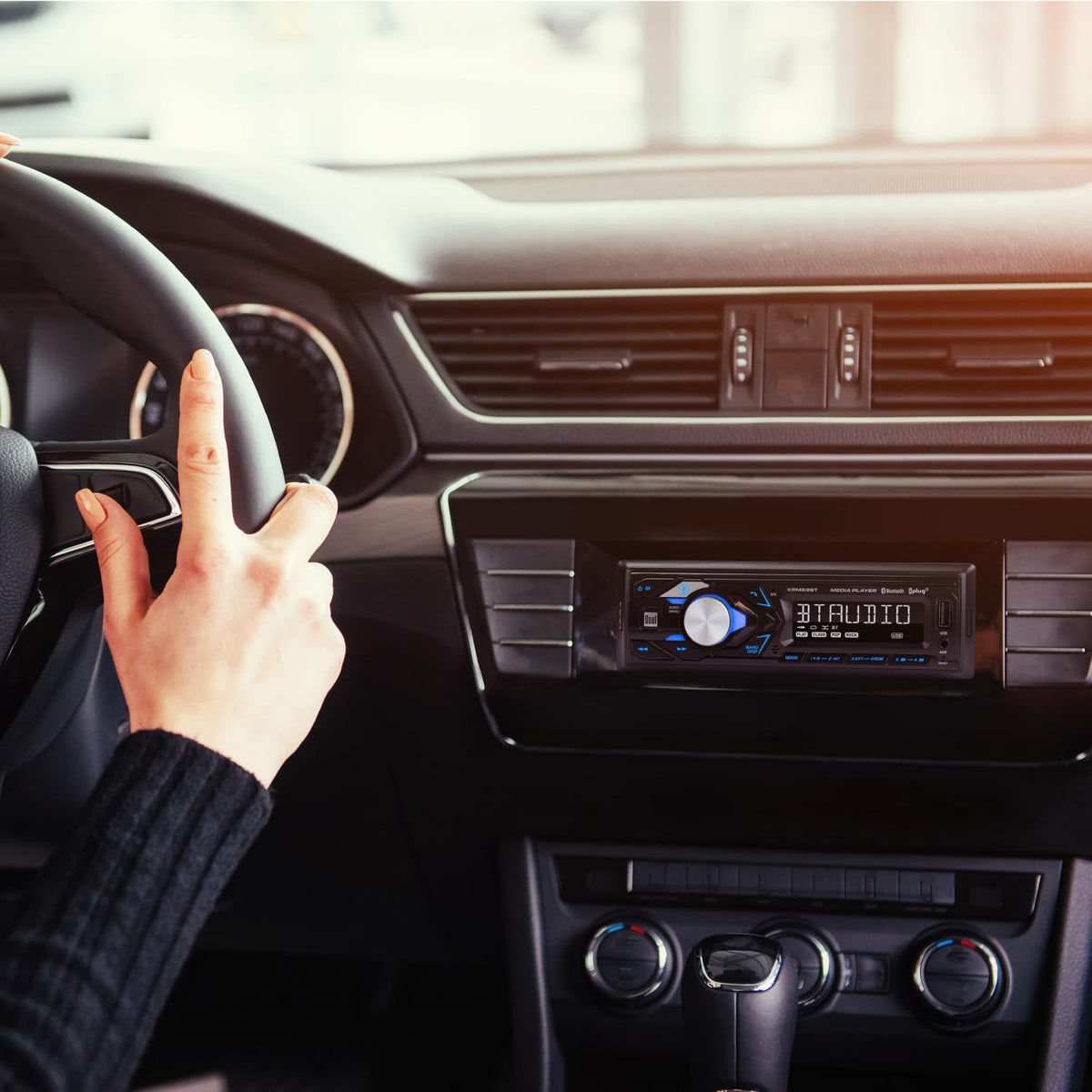 Dual Electronics XRM69BT in-car use with phone showing Bluetooth streaming benefit