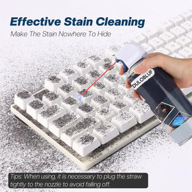dulobluf blowing dust from keyboard keys to improve typing performance and cleanliness