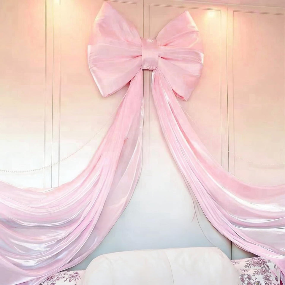 Dwsiplytg large pink bow backdrop 32x71 inches anchors a festive photo wall.