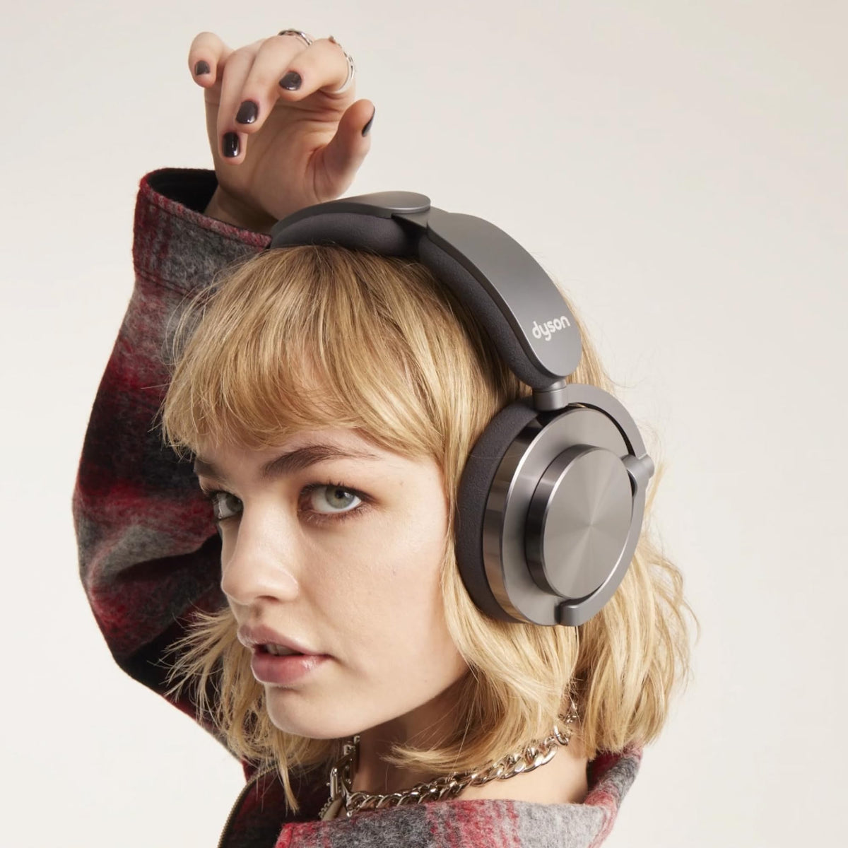 dyson OnTrac ear cushion worn on headphones demonstrating secure fit and comfort