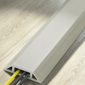 Eapele cord cover laid across a wood floor protecting cables and preventing trips in home
