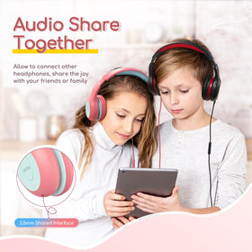 Children wearing EarFun K1 in study setting for focused learning