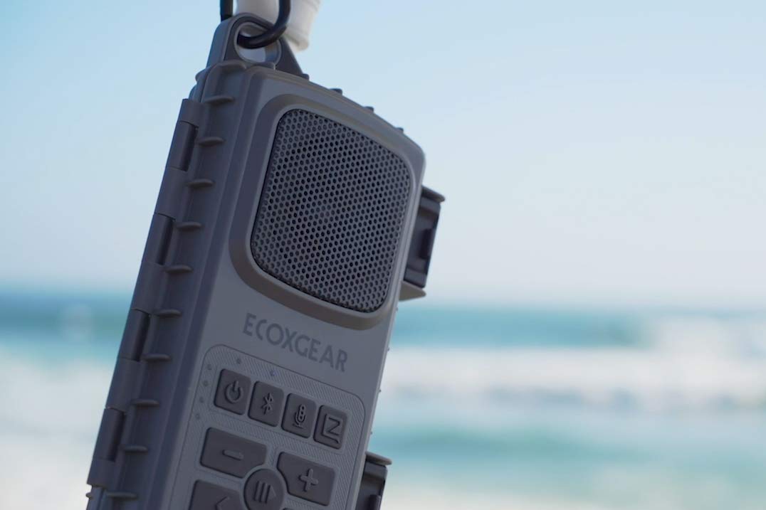 ECOXGEAR EcoExtreme 2 beside smartphone to show internal capacity — fits most phones