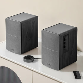 Edifier R1280T studio setup on a bookshelf for balanced, room-filling sound.