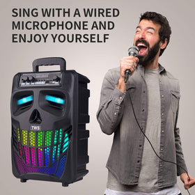 E I F E R portable speaker on garden table creating lively atmosphere