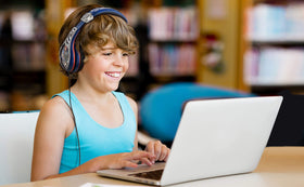eKids Avengers on a child watching a tablet for travel and remote learning