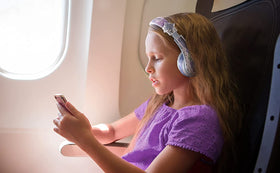 child wearing eKids Disney Frozen headphones demonstrating fit and kids’ use benefit