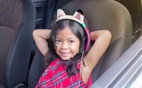 eKids Gabby's Dollhouse kids listening in car demonstrating share port for two listeners