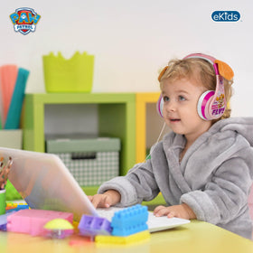 eKids worn by child using tablet, illustrating comfortable fit for learning or travel