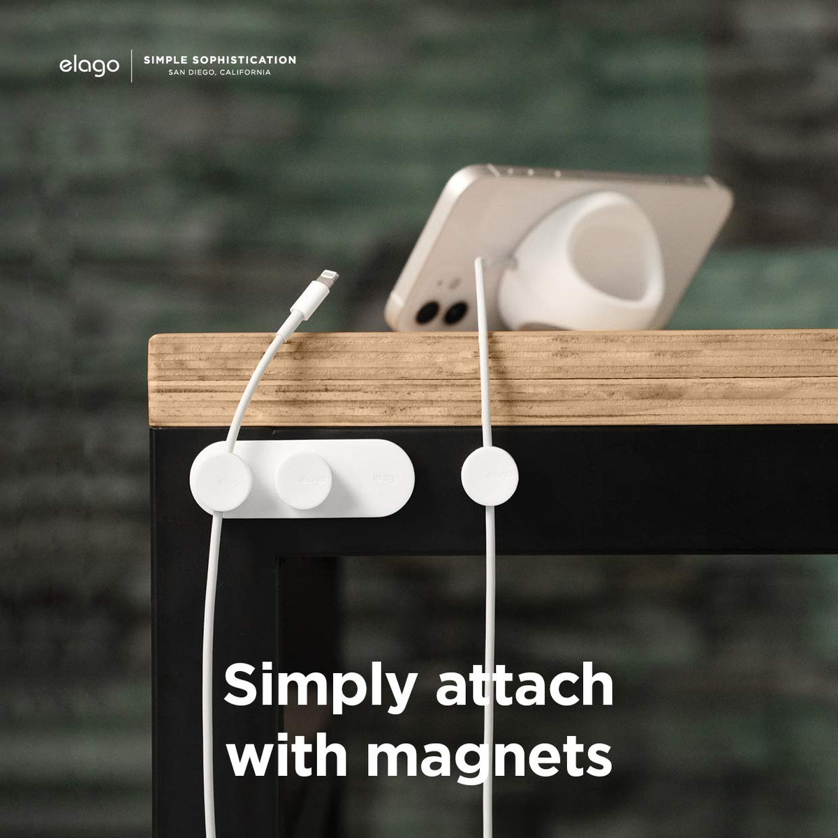 elago buttons on desk setup keeping cords organized and accessible