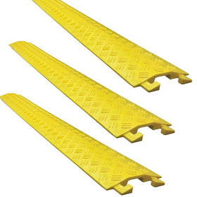 Electriduct Drop Trak small yellow cable protector guarding cords under a desk, reducing trip hazards