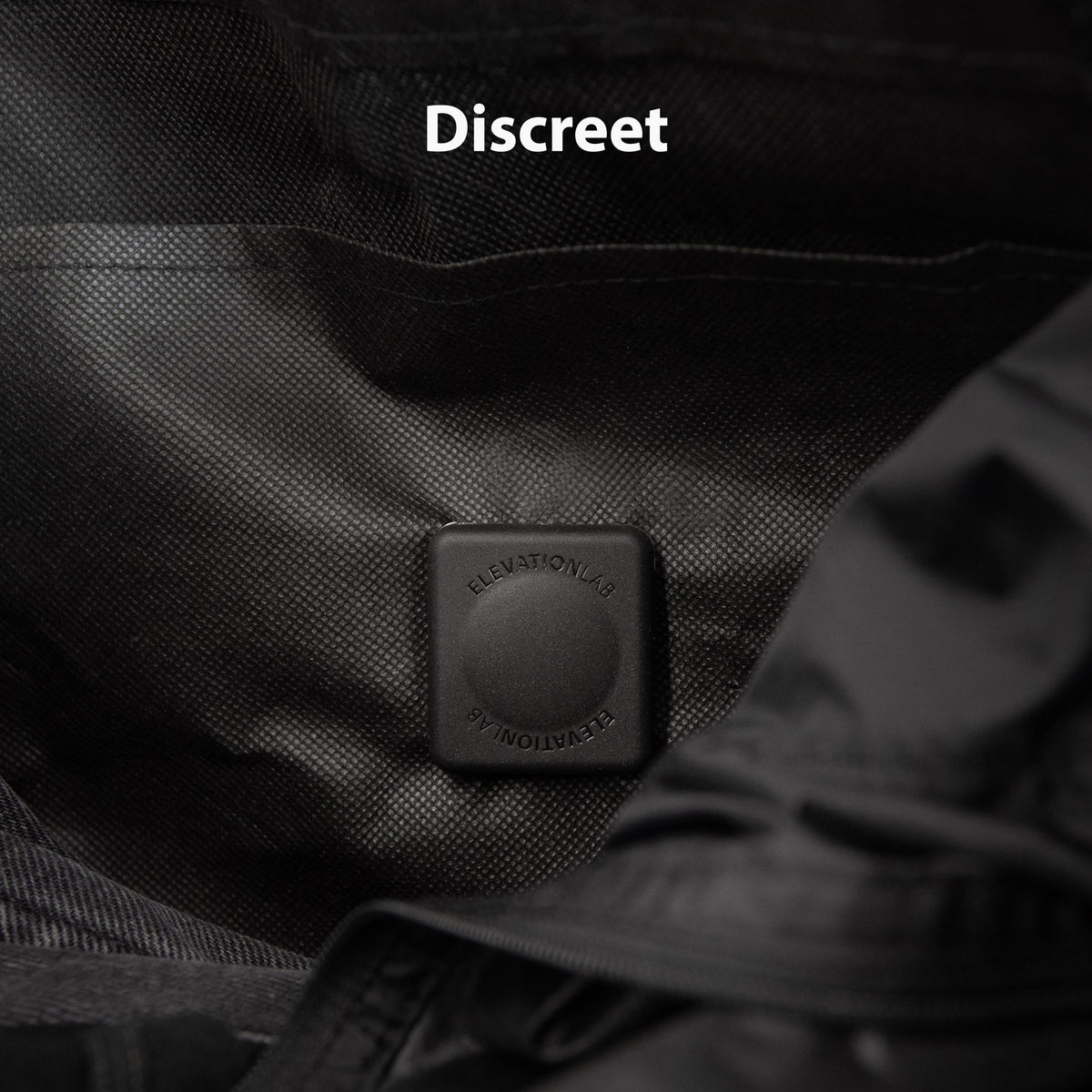 Elevation Lab TagVault AirTag dual pins on a jacket stay hidden and secure.