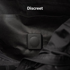 Elevation Lab TagVault AirTag dual pins on a jacket stay hidden and secure.