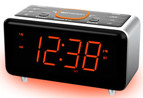 Compact Emerson clock resting on a nightstand
