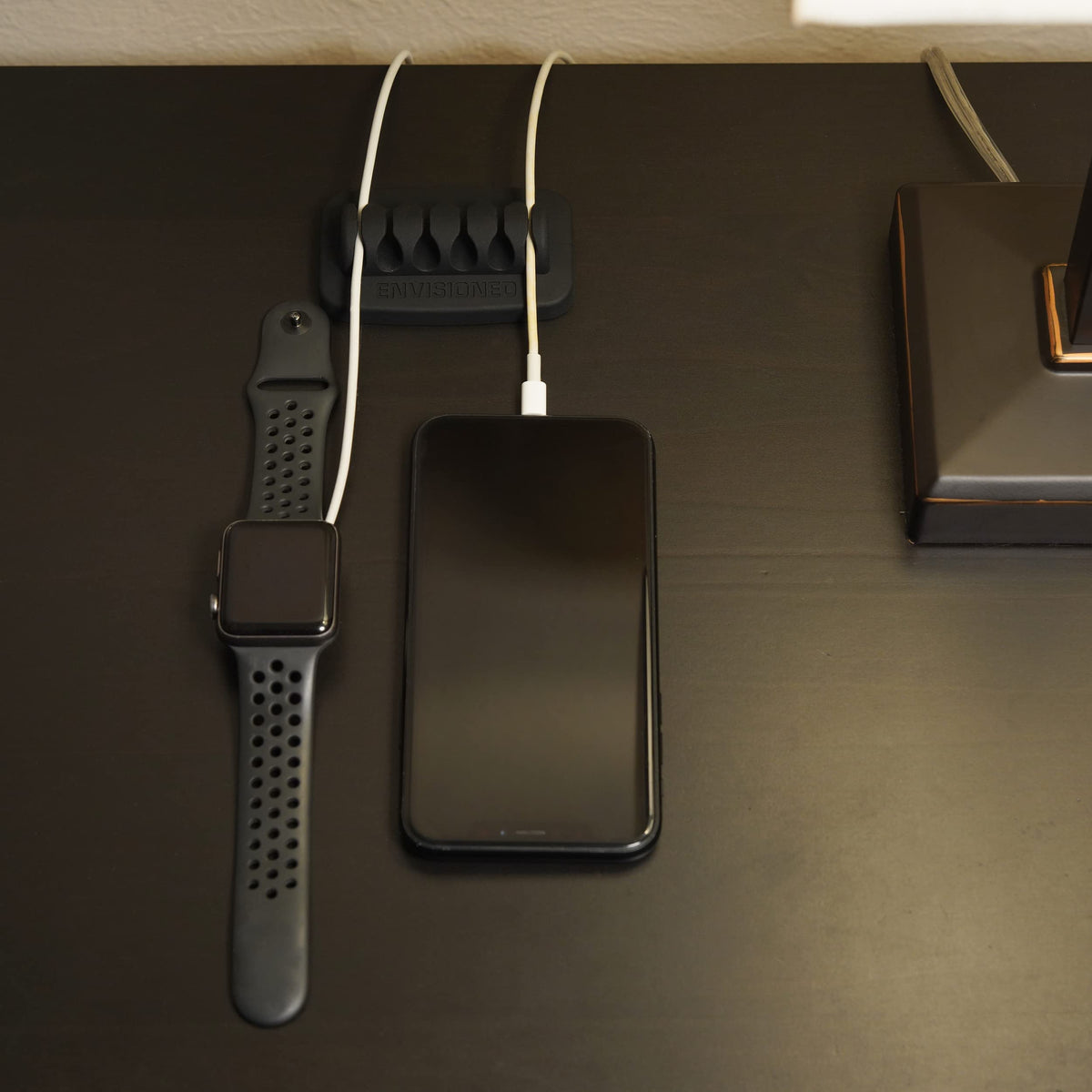 ENVISIONED weighty base preventing cables from sliding off the desk.