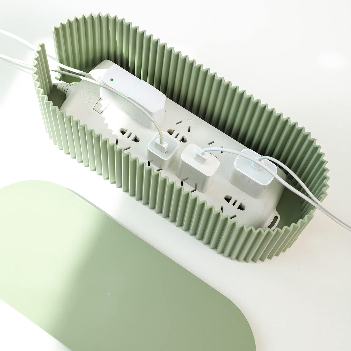 FABROK cable box small green on a desk demonstrates easy, clutter-free setup.