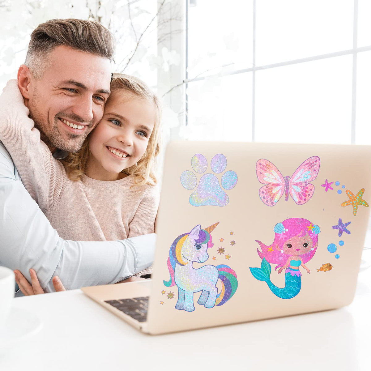 Fainne holographic sticker applied to laptop for stylish protection