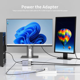 Fairikabe adapter on desk driving two HDMI monitors for extended workspace