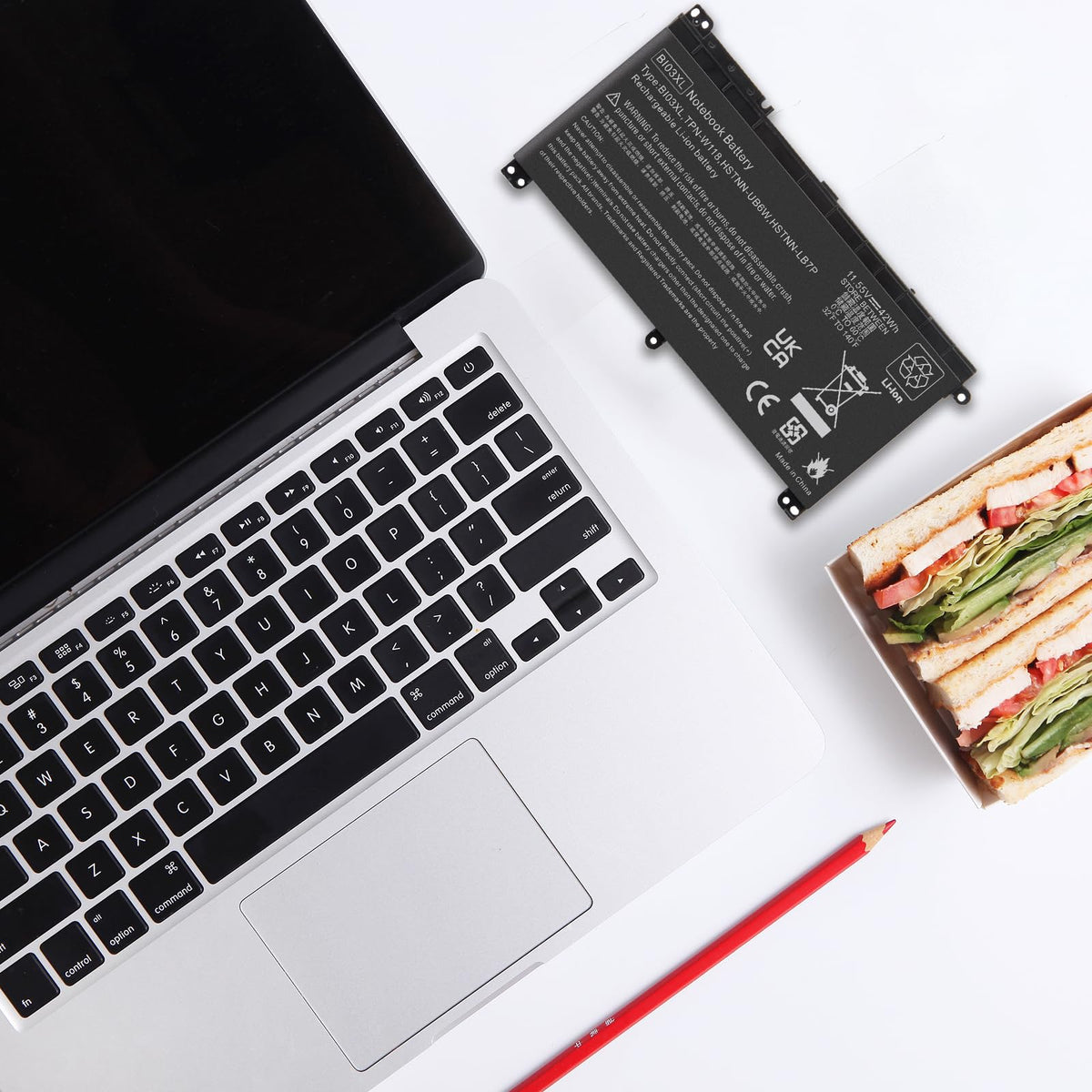Fancy Buying BI03XL on a desk powering a laptop for productive use