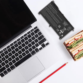 Fancy Buying BI03XL on a desk powering a laptop for productive use