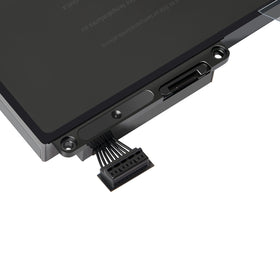 Fancy Buying battery placed on a desk with MacBook showing improved mobility and usability