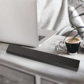 Fancy Buying battery on desk with laptop, conveys reliable daily power