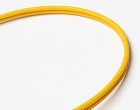 FCD LC connector close-up showing ceramic ferrule for precise alignment and low insertion loss