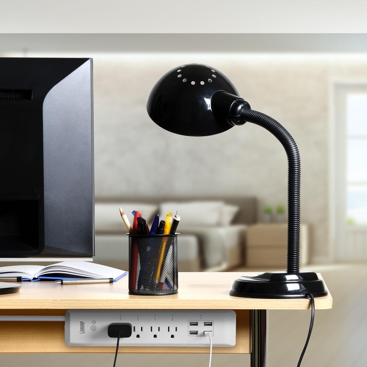 Feit Electric alongside phone for scale showing compact footprint