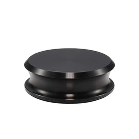 FEMELI record weight stabilizer under dust cover on a turntable for safer playback.