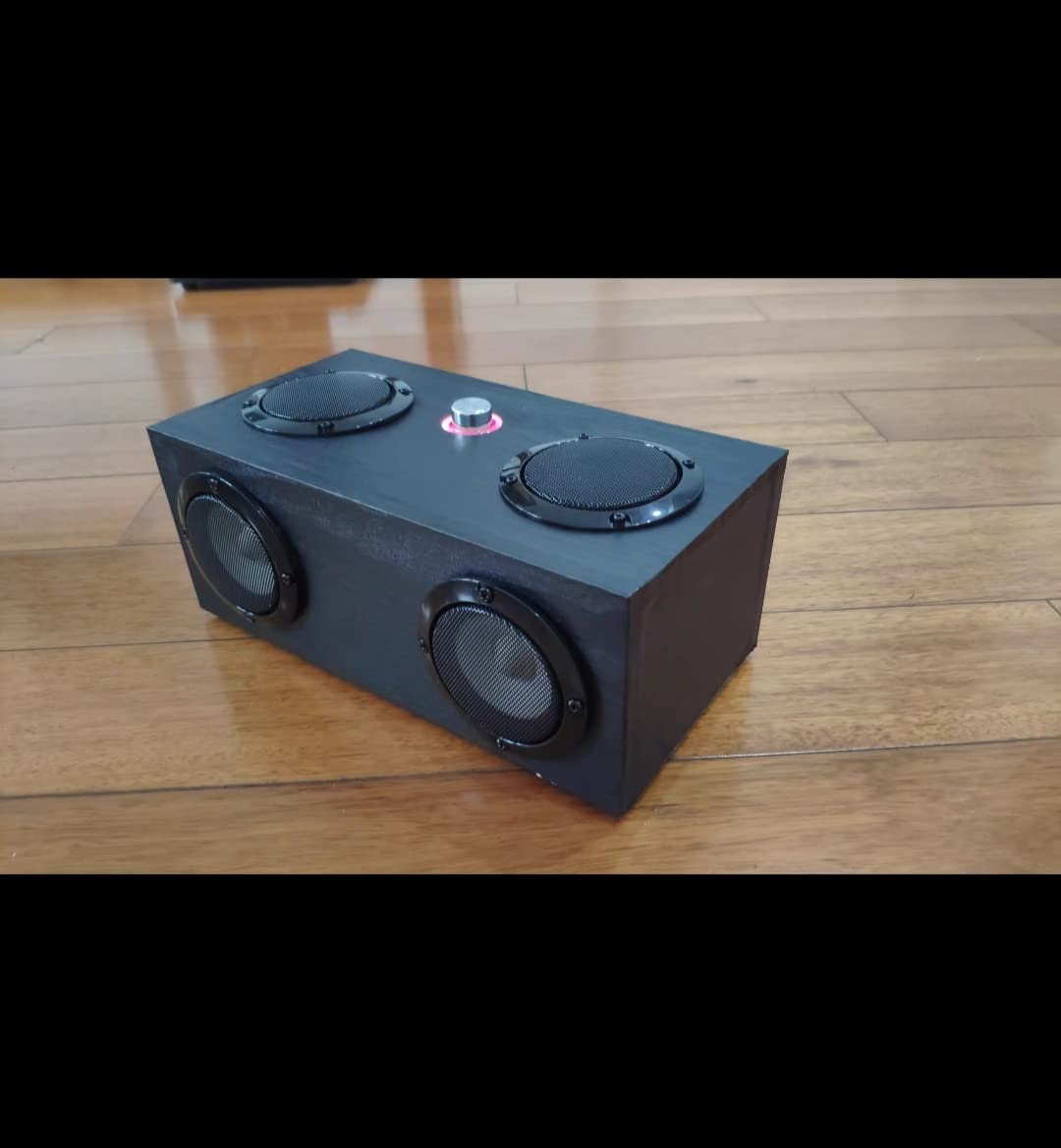Fielect lifestyle speaker setup showing installed grill protecting woofer and blending aesthetics