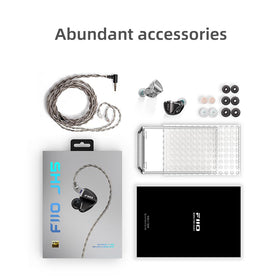 FiiO JH5 next to coin for scale, showing compact size and portability benefit